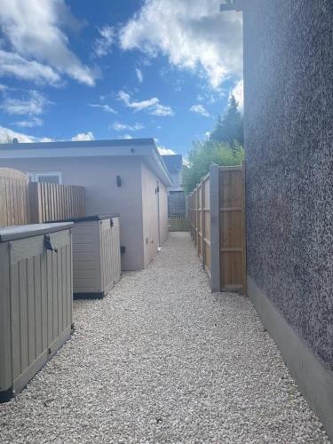 a row of garages are lined up next to a building at Salisbury Guest Ąnnex in Salisbury
