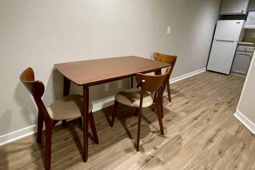 a dining room table and chairs in a room at Aksarben Gem- WFH corner desk & minutes from I-80 in Omaha