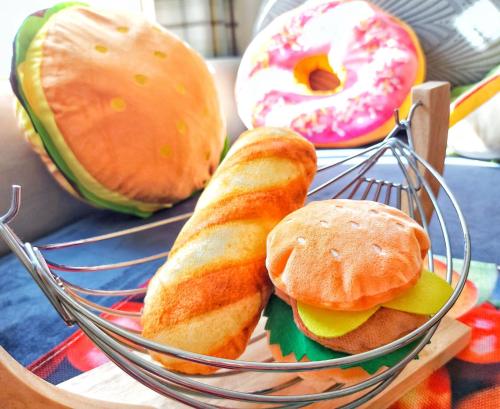 a basket with a sandwich and a donut on a table at The Relish - ground floor flat in Largs in Largs