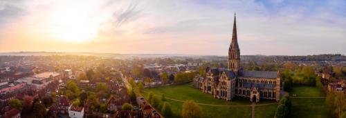 a large building with a spire in a city at Salisbury Guest Ąnnex in Salisbury