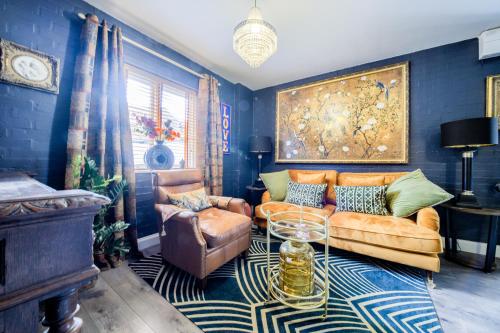 a living room with a couch and a chair at Romeo & Juliet's with Private Parking in Stratford-upon-Avon