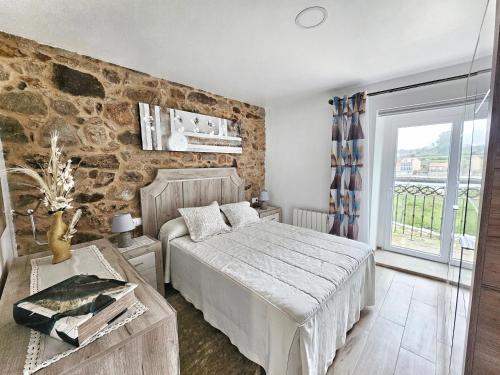 En eller flere senge i et værelse på Casa da Colorada - Costa da Morte