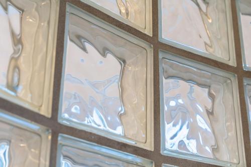 a wall of glass with a picture of a horse at Day Dream Soleyjargata Rooms & Apartments in Reykjavík
