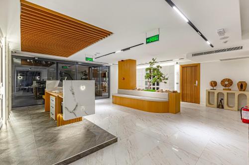 a lobby of a store with a kitchen and a counter at Dulcet Hotel in Antalya