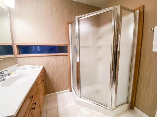 a bathroom with a shower and a sink at Telluride Lodge Your mountain gateaway in Telluride