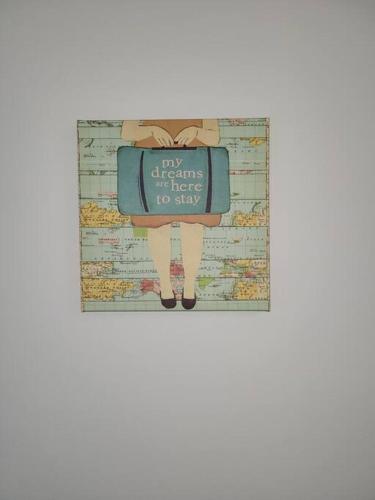 a picture of a person with a suitcase on a map at Davenport Dwellings-Three Bedroom in Omaha