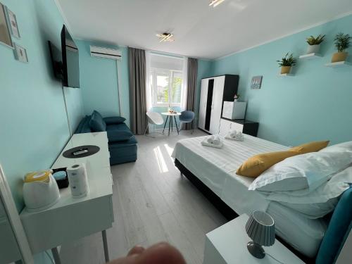 a bedroom with a bed and a living room at A-more accommodation in Split