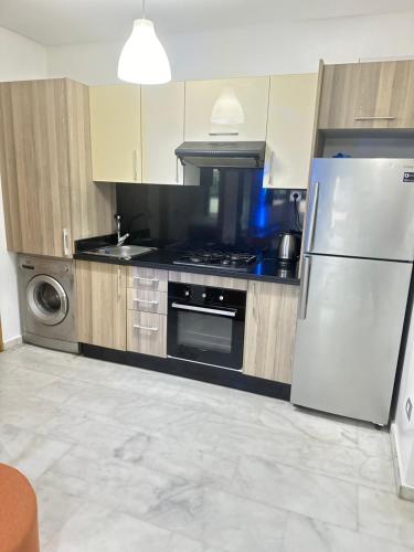 Kuchyň nebo kuchyňský kout v ubytování Appartement confortable au corniche