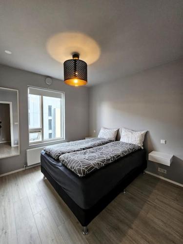 En eller flere senge i et værelse på Tranquil Reykjavik Hideaway