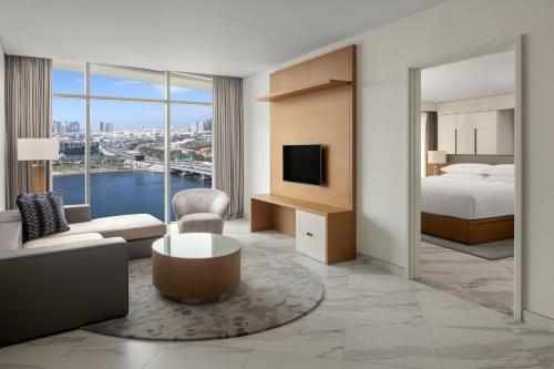 a hotel room with a bed and a view of the city at Marriott Marquis Dubai Creek in Dubai
