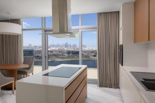 a kitchen with a view of the city at Marriott Marquis Dubai Creek in Dubai