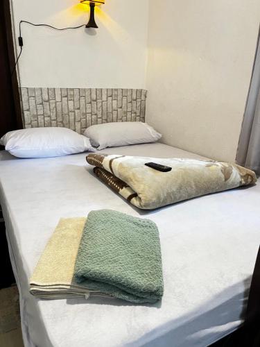 Cama ou camas em um quarto em Hostel Uai