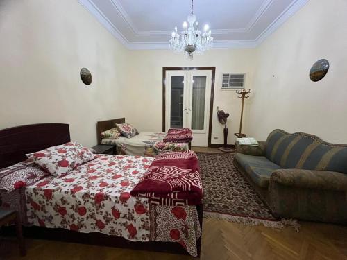 a living room with a bed and a couch at Beautiful apartment in the heart of cairo in Cairo