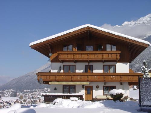 a large building with snow on the roof at Haus Fernblick in Neustift im Stubaital