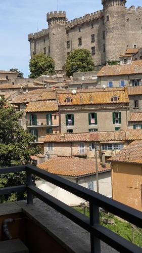 a view of a city with a castle at Casa Silvia in Bracciano