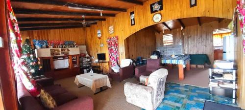an aerial view of a living room with a christmas tree at AerowView Home Retreat in Matei