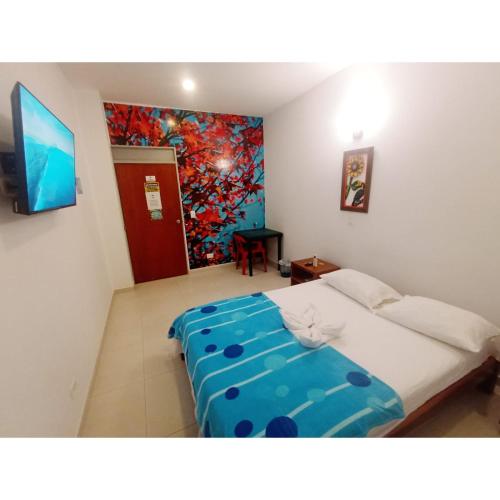 Posteľ alebo postele v izbe v ubytovaní Hotel el Tesoro