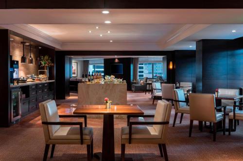 a dining room with a table and chairs at The Ritz-Carlton, Denver in Denver