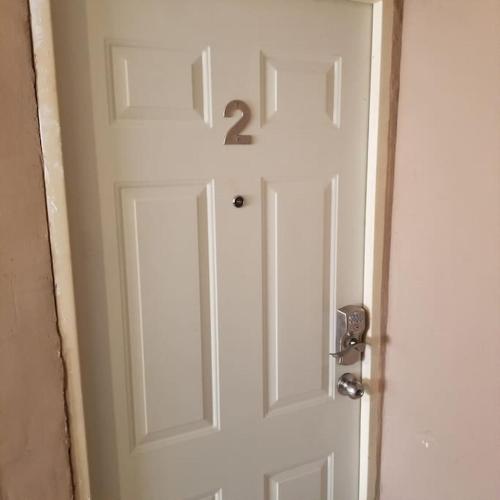 a white door with the number two on it at Suite con 2 recamaras,2mini splits, Parking Wifi 100 mb, cocina in Ciudad Valles
