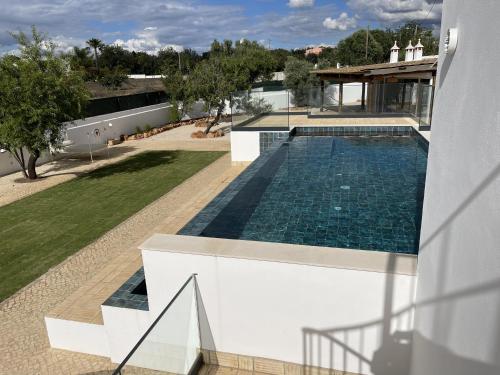 an overhead view of a swimming pool in a house at Monte Gerações - Heated pool - Typical Algarvian - close to Quinta Lago, Vale Lobo and Vilamoura in Almancil