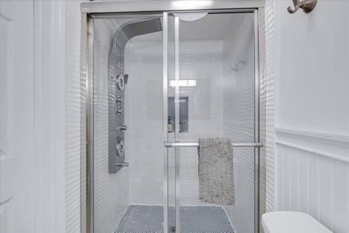 a shower with a glass door in a bathroom at 180 SKI CAMELBACK-SKI-ON -SKI OFF,SNOW TUBING,Paintball in Tannersville