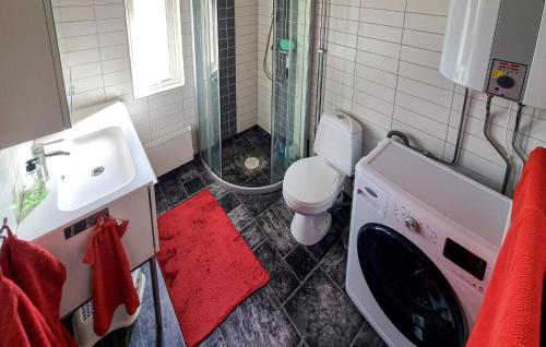 a bathroom with a sink and a washing machine at Beautiful Home In Sankt Anna With Kitchen in Sankt Anna