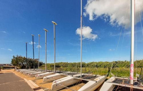 a row of boats lined up in a parking lot at Awesome Home In Saint-Michel-Chef-Chef in Saint-Michel-Chef-Chef