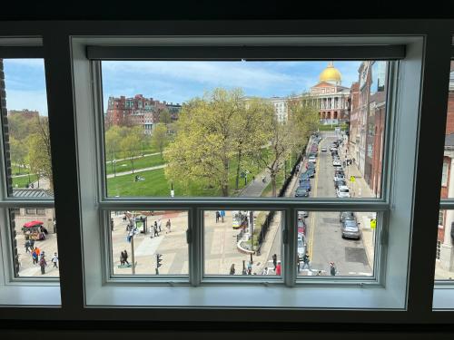 a view of a city from a window at The Monty Boston in Boston