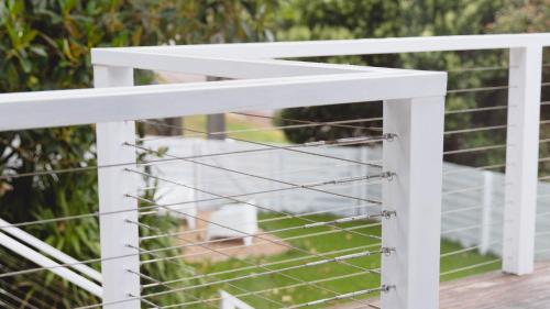a white bird cage on a deck at Lake Metung in Metung