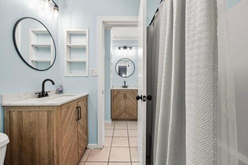 a bathroom with a sink and a mirror at Ocean Creek 2208 in Myrtle Beach