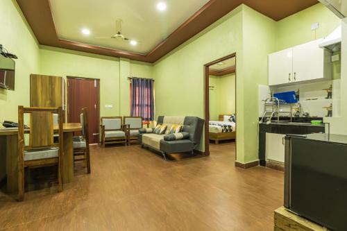 a living room with a couch and a table at Sisai Park Village in Chitwan