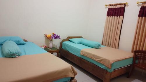 Ένα ή περισσότερα κρεβάτια σε δωμάτιο στο Anish Homestay