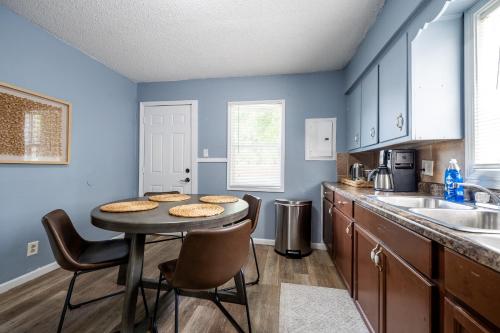 a kitchen with a table with cookies on it at Affordable, Quaint Retreat! 5 Mins to Downtown in Indianapolis