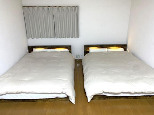 Tempat tidur dalam kamar di Hibisha - Vacation STAY 66595v