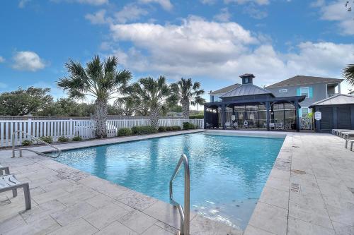 a swimming pool with a gazebo next to a house at Casa de Flip Flops in Rockport