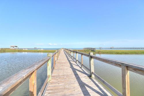 a wooden bridge over a body of water at Casa de Flip Flops in Rockport