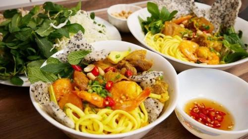 a group of bowls of food on a table at Sunny Homestay Quy Nhơn in Quy Nhon
