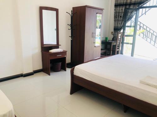 Cama o camas de una habitación en SKY SEA-Arugambay
