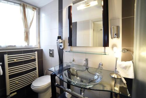 a bathroom with a sink and a toilet at Villa Zrina in Zagreb