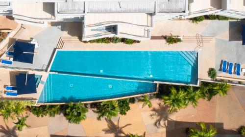 an overhead view of a swimming pool in a resort at Azure Sea Whitsunday Resort in Airlie Beach