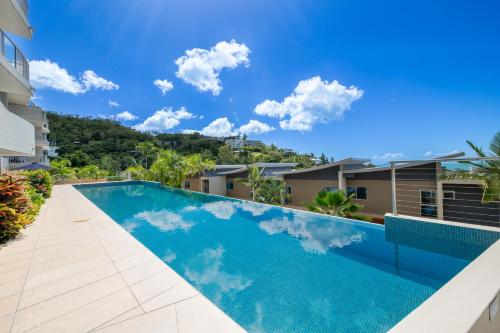 an image of a swimming pool in a building at Azure Sea Whitsunday Resort in Airlie Beach
