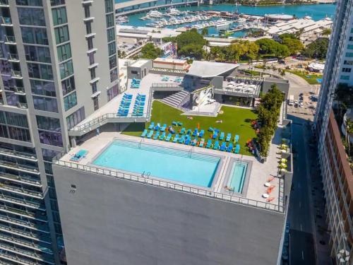 an overhead view of a pool on the roof of a building at Breezy Stays Luxury Residences - near Kaseya Center in Miami