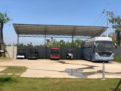 a bus is parked in a parking lot at Private Villa in Phumĭ Prêk Chrey