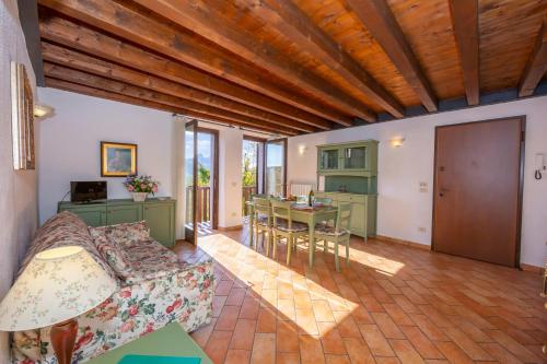 a living room with a couch and a table at Orchidea in Hilly area - Happy Rentals in Gargnano