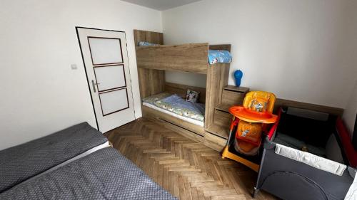 a room with two bunk beds and a bed at DáMa in Ružomberok