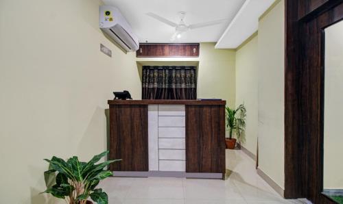 a lobby with a wooden podium in a building at Hotel Park Central in Kolkata