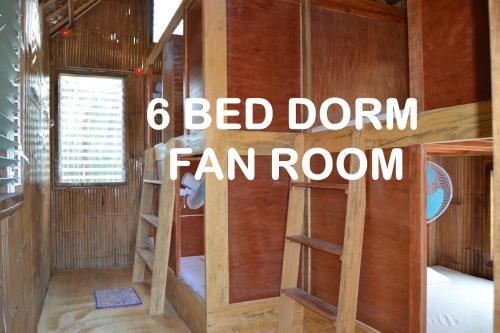 a bed dorm fan room with bed bunk beds at Russell Place in San Vicente