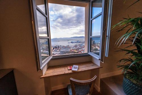a window seat with a view of the harbor at Palazzo Boyl 1840 in Cagliari
