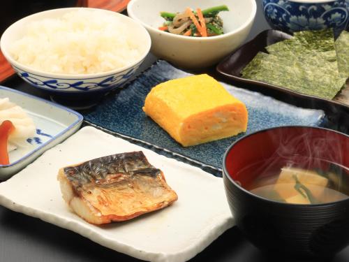 a table with plates of food and bowls of food at Shiroyamasou in Asahi