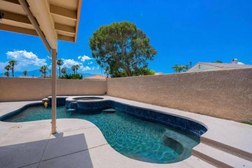 a swimming pool in the backyard of a house at Spacious house with pool at Mission Lake in Desert Hot Springs
